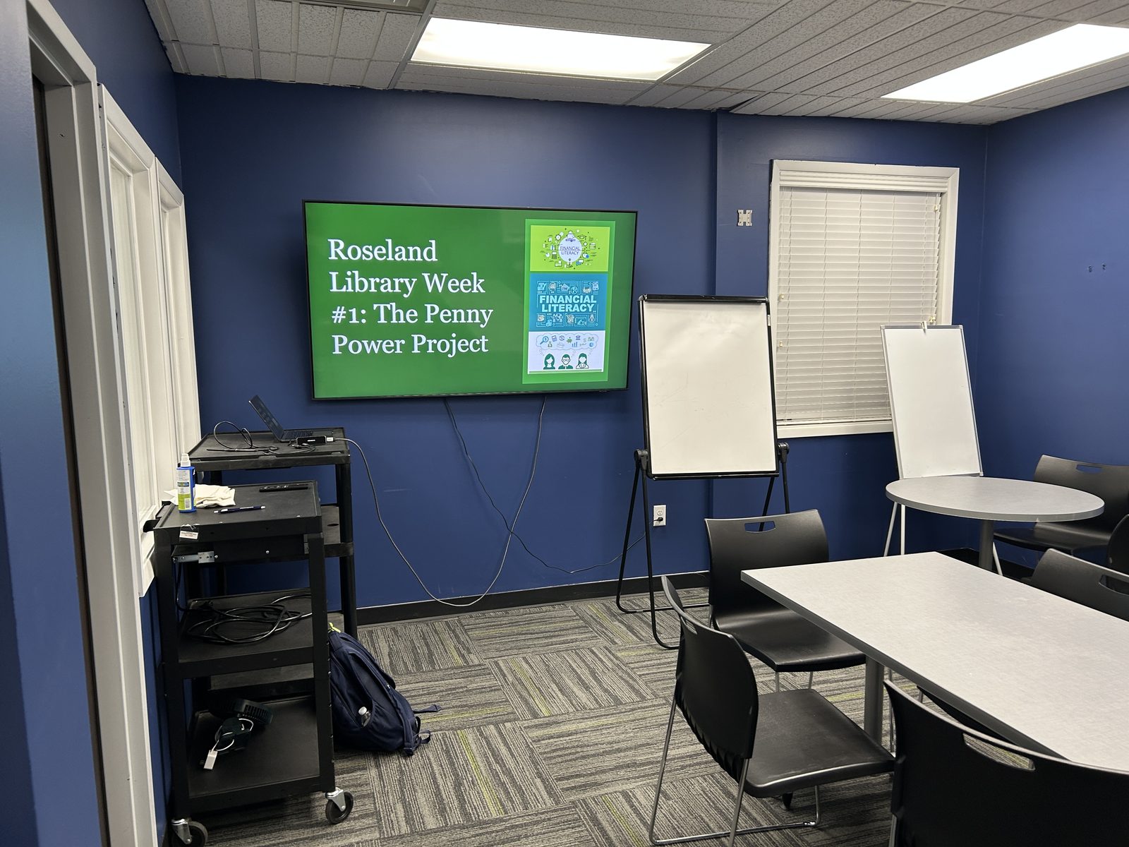 Roseland Library meeting room with the Penny Power Project week one slide on the screen