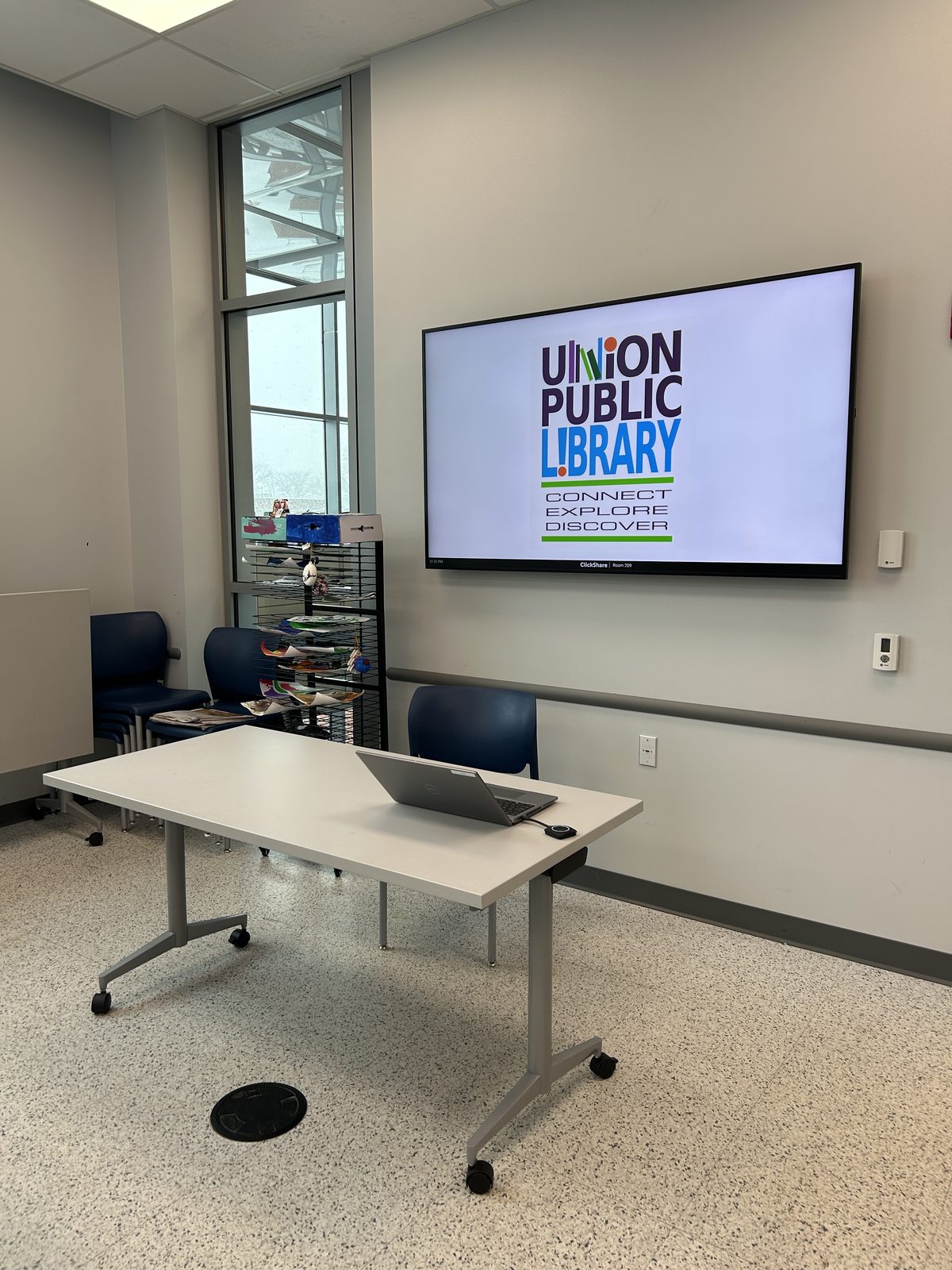 Union Public Library meeting room with the library logo on the screen