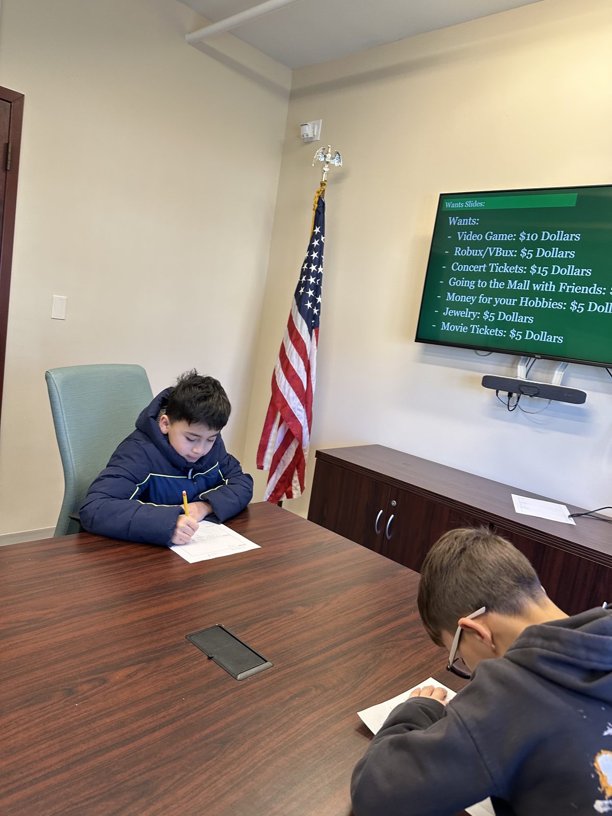 Students writing during the Verona Library program